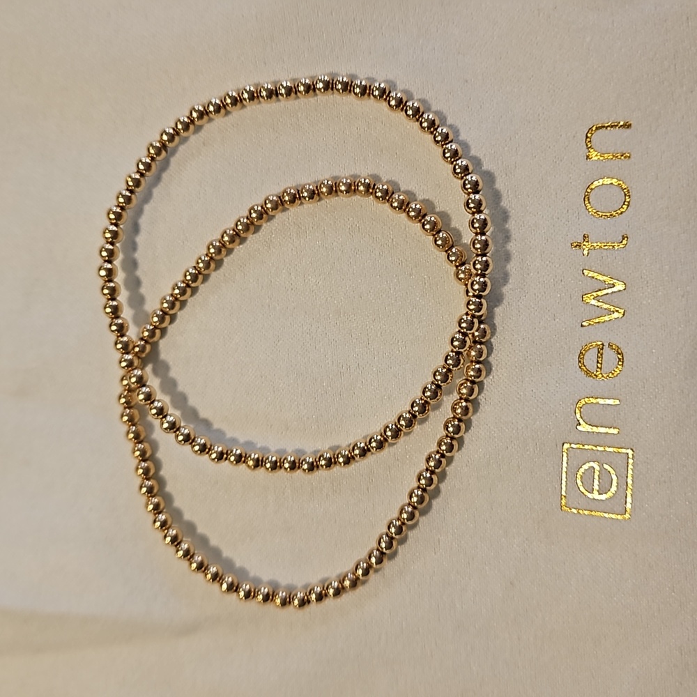Pair of Enewton classic size gold 3mm bead bracelets